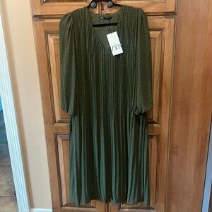 ZARA. approximately 46” long, sleeves are 23 “ with elastic at the wrist.